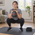 Person doing a goblet squat with a Bowflex SelectTech 840 kettlebell in a small living room