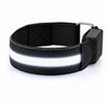 A black LED armband on a white background with its centre strip lit white.