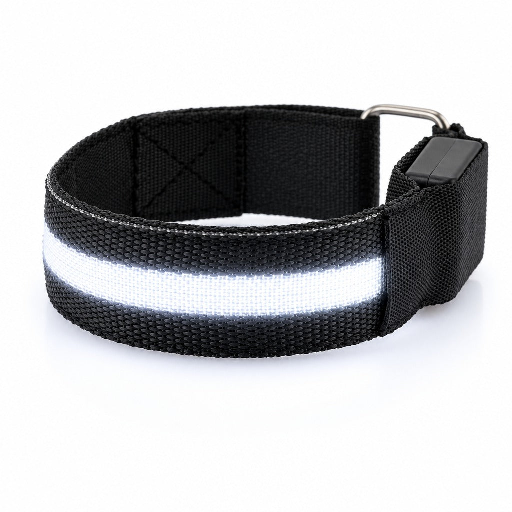 A black LED armband on a white background with its centre strip lit white.