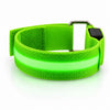 A green LED armband on a white background with its centre strip lit green.