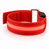 A red LED armband on a white background with its centre strip lit red.