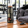Optimum Nutrition High Protein Shake 330ml bottle on a gym bench after a workout