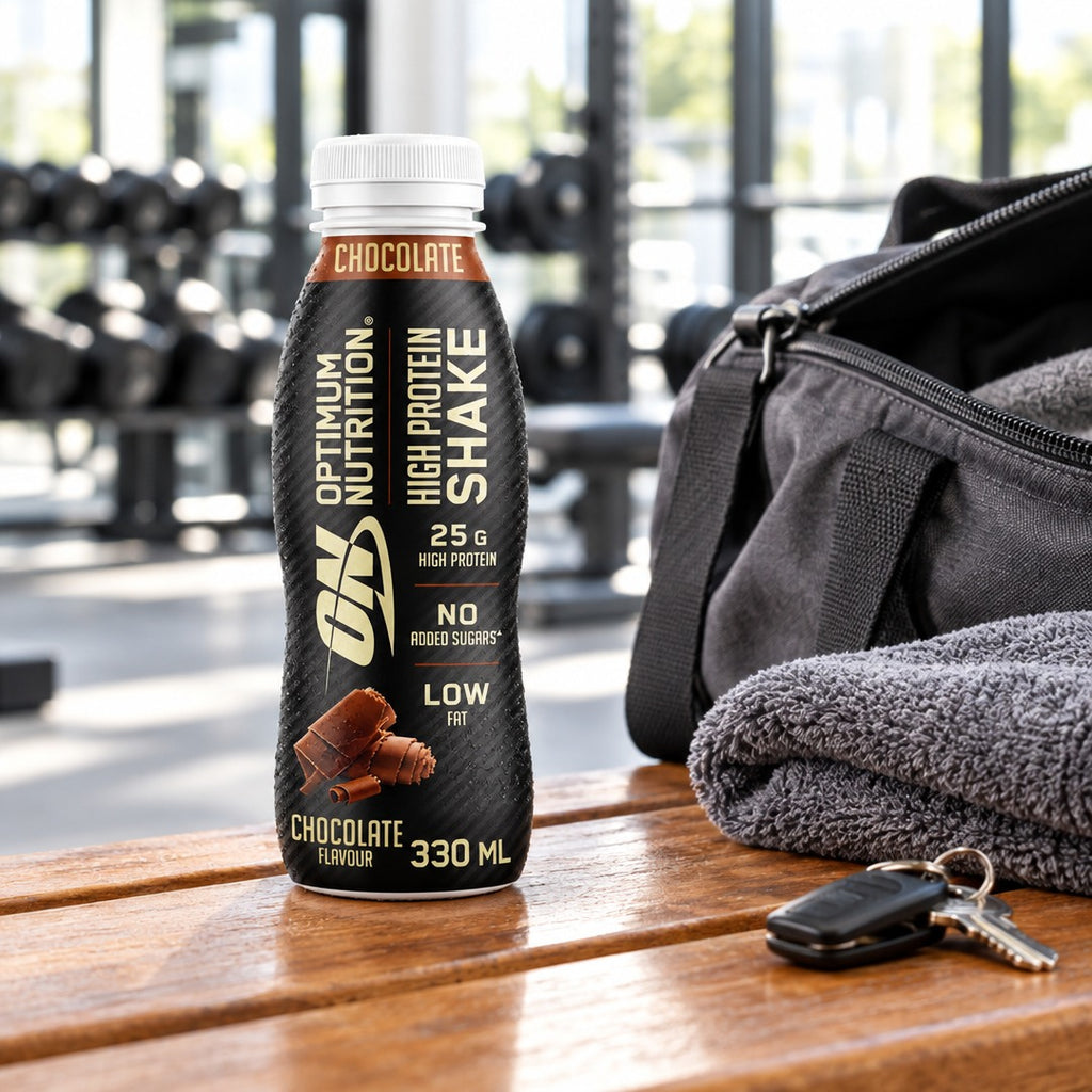 Optimum Nutrition High Protein Shake 330ml bottle on a gym bench after a workout