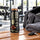 Optimum Nutrition High Protein Shake 330ml bottle on a gym bench after a workout