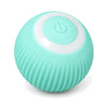 Close-up of one mint-green rolling ball, showing its ribbed shell, the white ring and the power button.