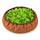 A round snuffle bowl on a white background, with a brown fabric rim and a bed of green felt strips hiding pieces of dry food.