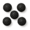 Five black spiky massage balls on white