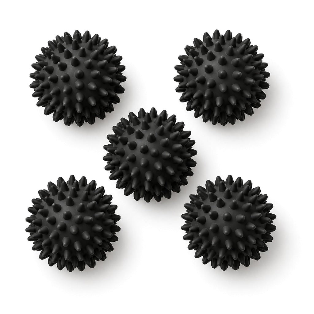 Five black spiky massage balls on white