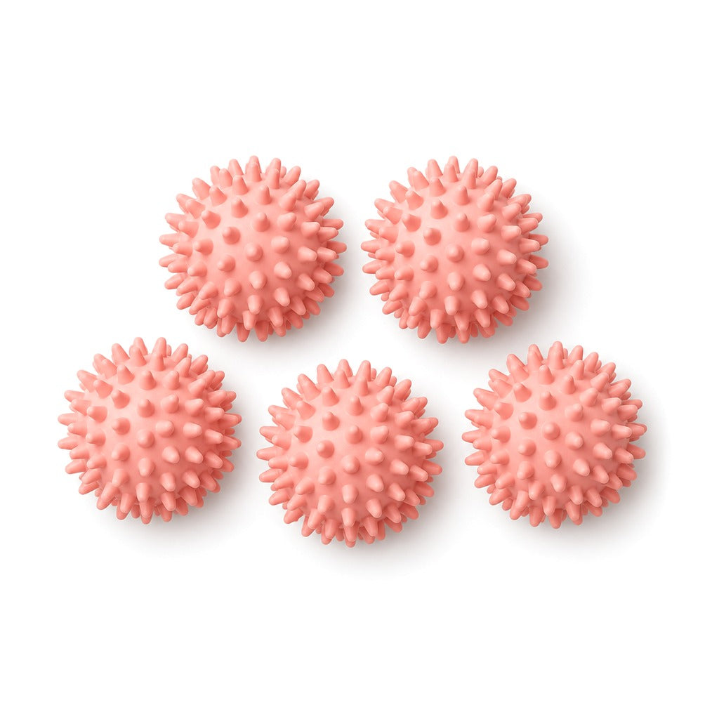 Five pink spiky massage balls on white