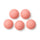 Five pink spiky massage balls on white