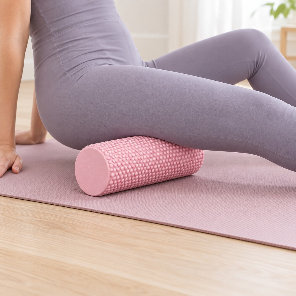 Rolling the back of the thigh on a foam roller