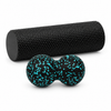 Black foam roller and blue peanut massage ball on white