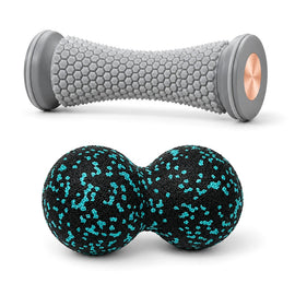 Studded foot roller and peanut massage ball on white