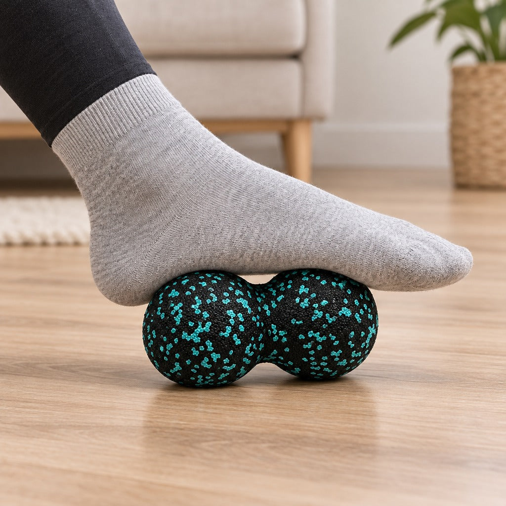 Sole of a foot rolling over a peanut massage ball