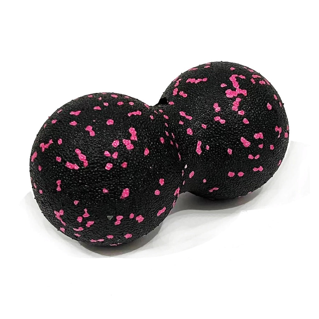 Pink peanut massage ball on white